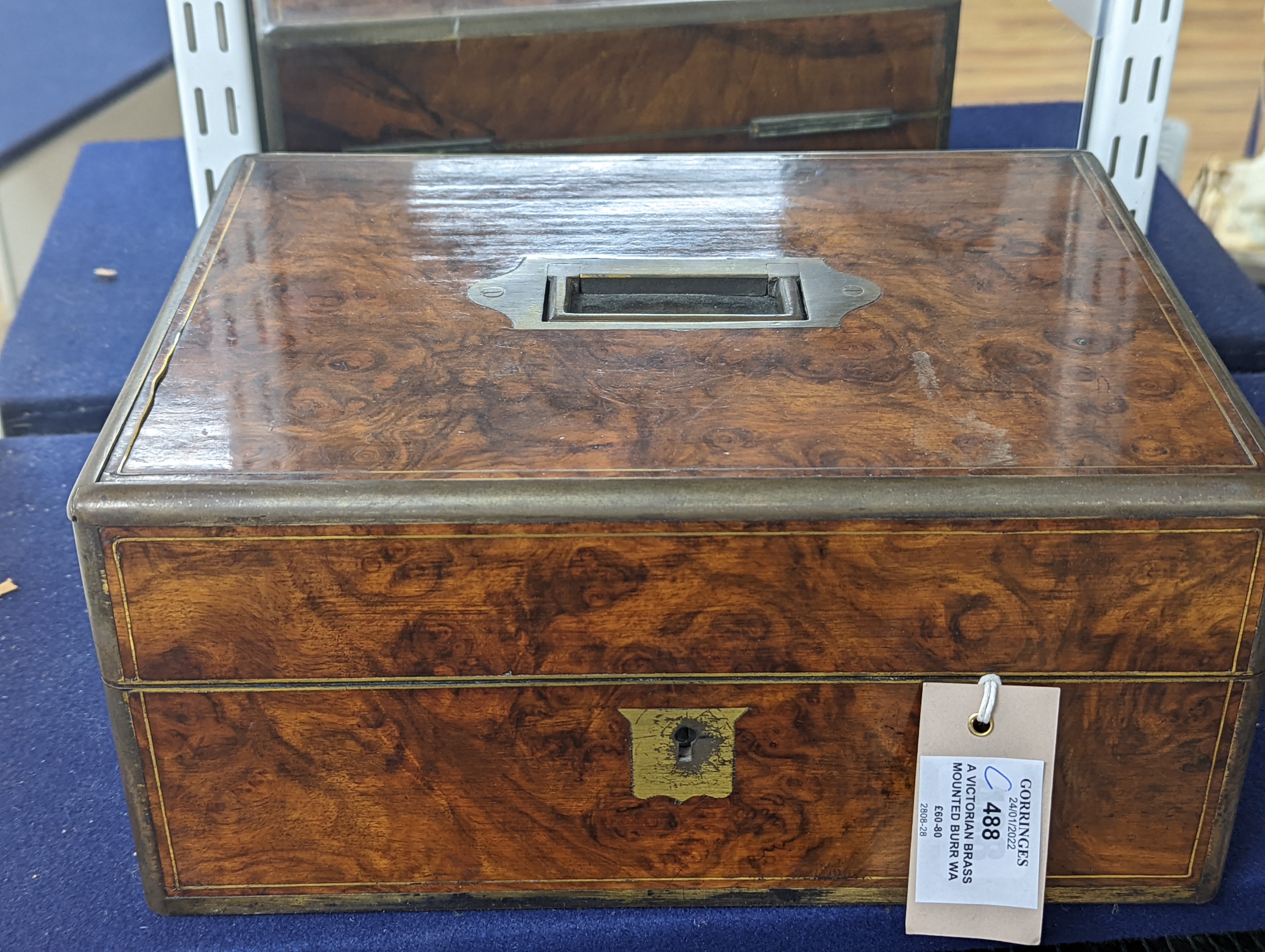 A Victorian brass mounted burr walnut toilet box, fitted with glass jars with electroplated tops, Width 30 cms. Ivory mounted items included